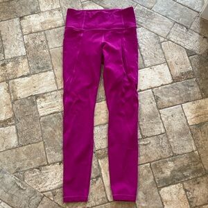 Athleta stash pocket salutation tight with powervita fabric. Small